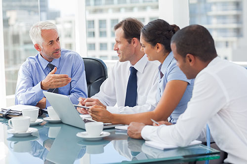 Group of business people brainstorming together Group of business people brainstorming together
